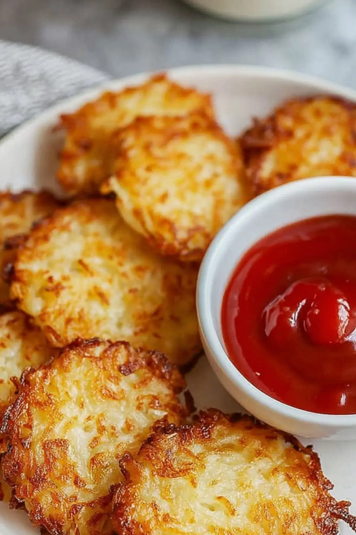 Crispy air fryer hash browns from scratch on a plate