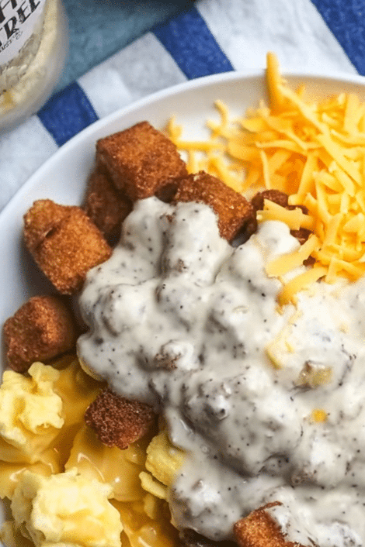 Easy Breakfast Bowls with crispy potatoes, eggs, and sausage gravy