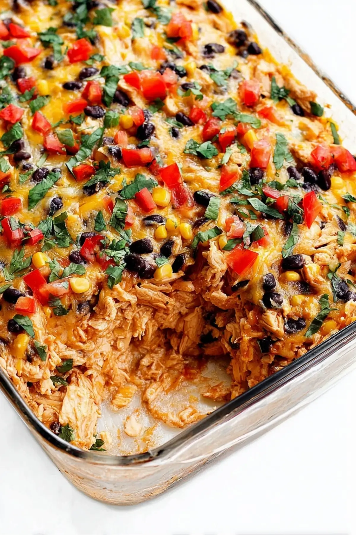 Easy Chicken Burrito Casserole baked with rice, beans, and cheese
