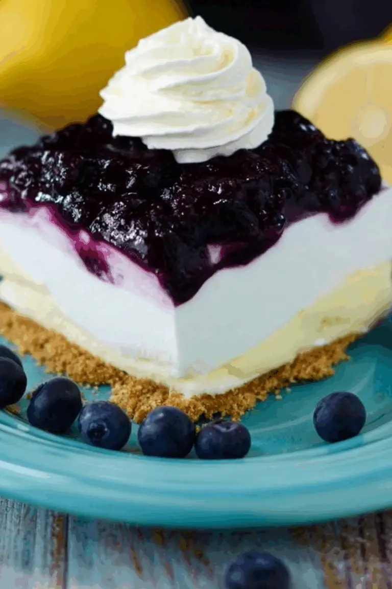No Bake Lemon Blueberry Dessert with layers of lemon and blueberry topping
