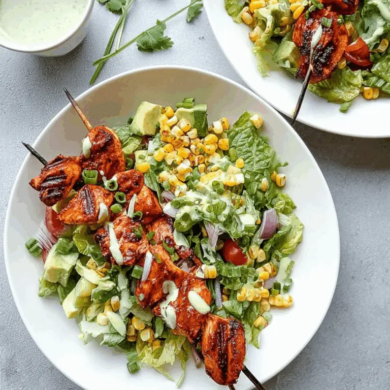 BBQ Chicken Skewer Salad with grilled corn, ranch dressing, and fresh greens