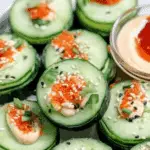 cucumber sushi rolls filled with avocado, smoked salmon, and colorful vegetables