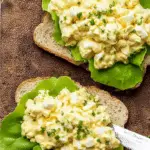 Egg salad sandwich served on toasted bread with fresh lettuce