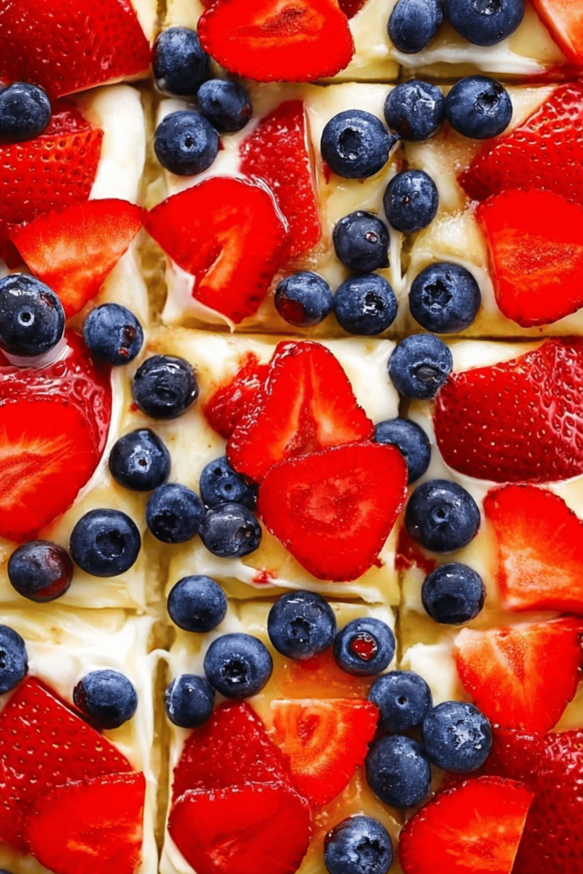 Fruit pizza with fresh fruit toppings on a sugar cookie crust