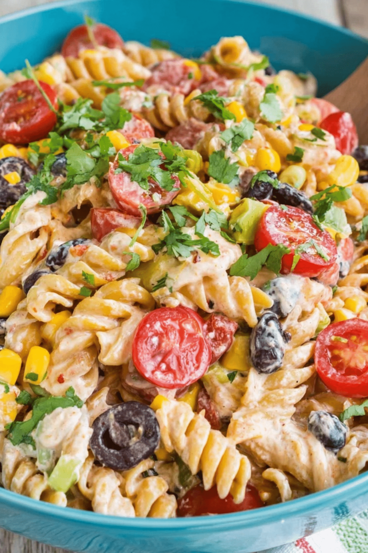 Mexican Pasta Salad in a bowl with creamy dressing and vegetables