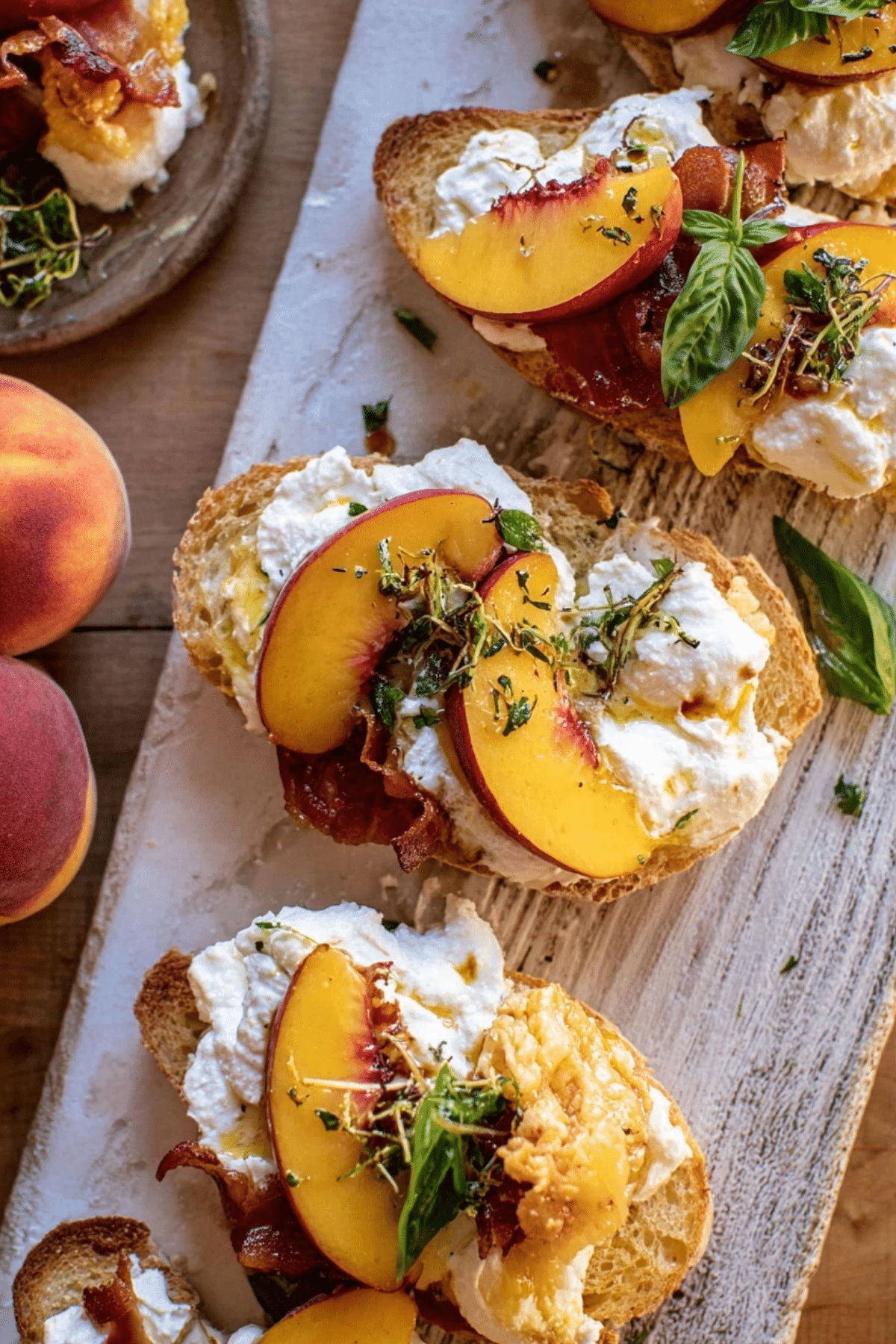 Peach Burrata Parmesan Crostini topped with hot honey and basil