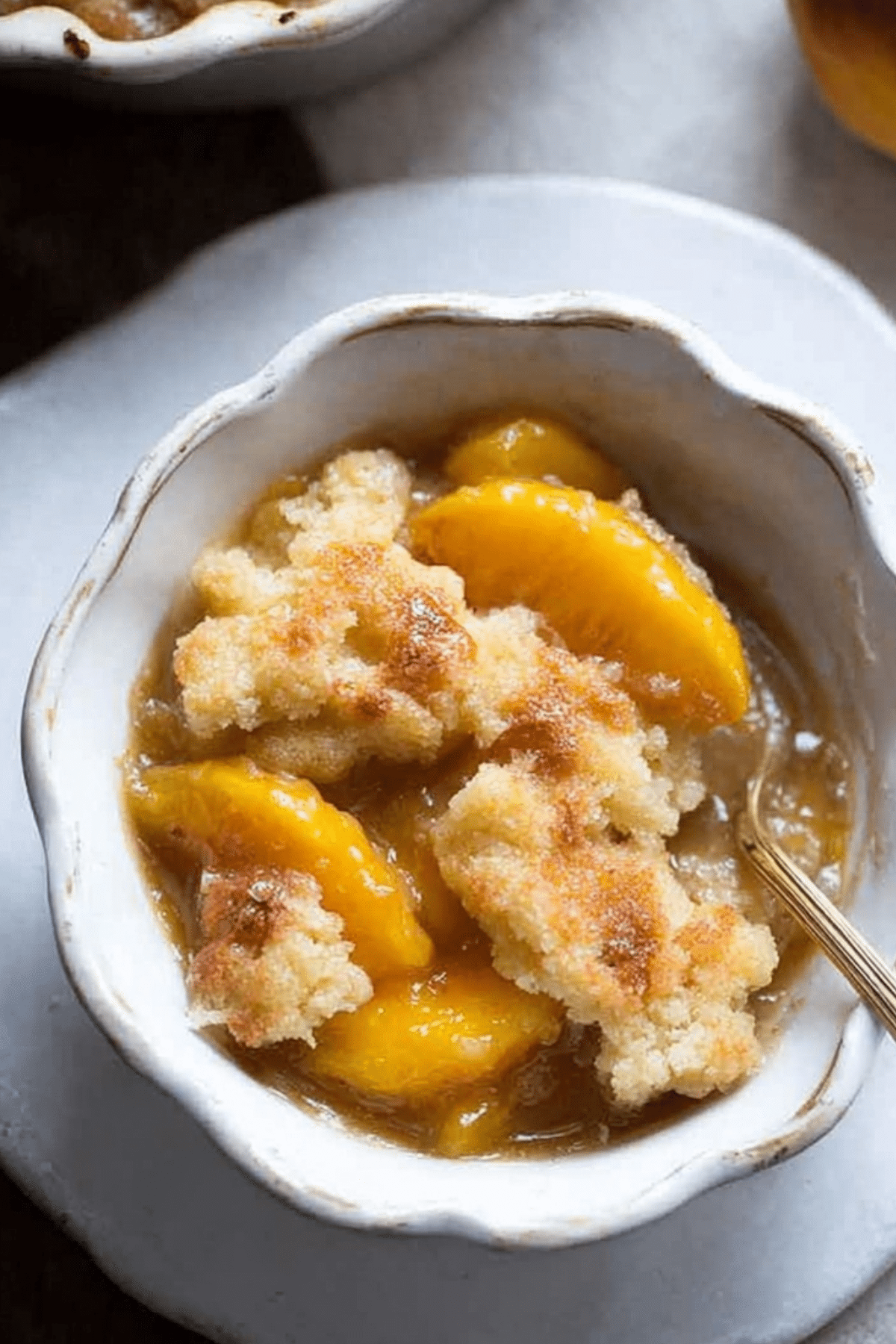 Homemade peach cobbler with buttery crust and fresh peaches