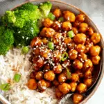 Vegan Sticky Sesame Chickpeas served with rice and veggies