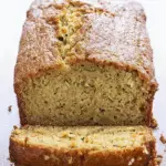 Zucchini Bread sliced on a wooden board