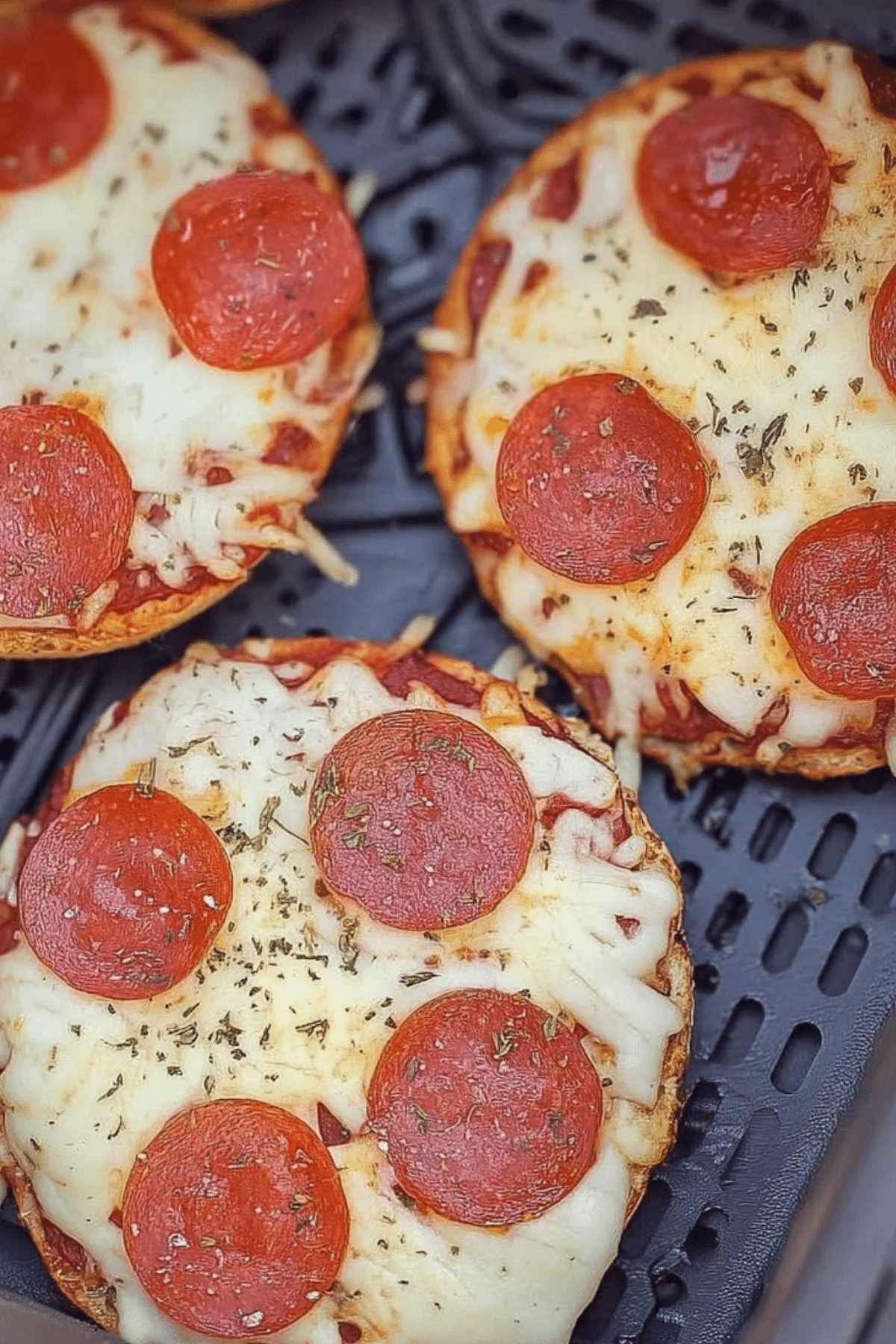 Air Fryer Bagel Pizzas with melted cheese and toppings