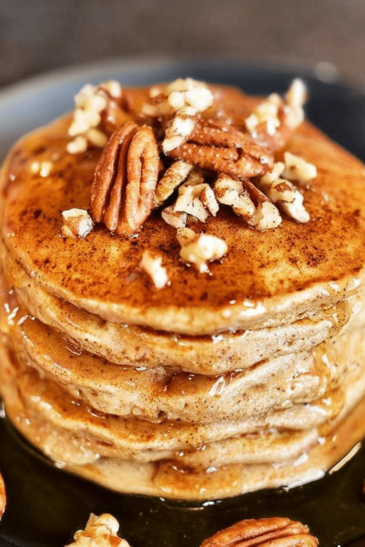 Apple Butter Pancakes topped with syrup and pecans