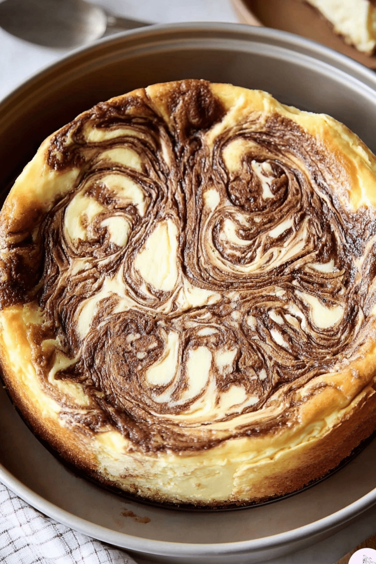 Cinnamon Roll Cheesecake slice with creamy filling and cinnamon swirl"