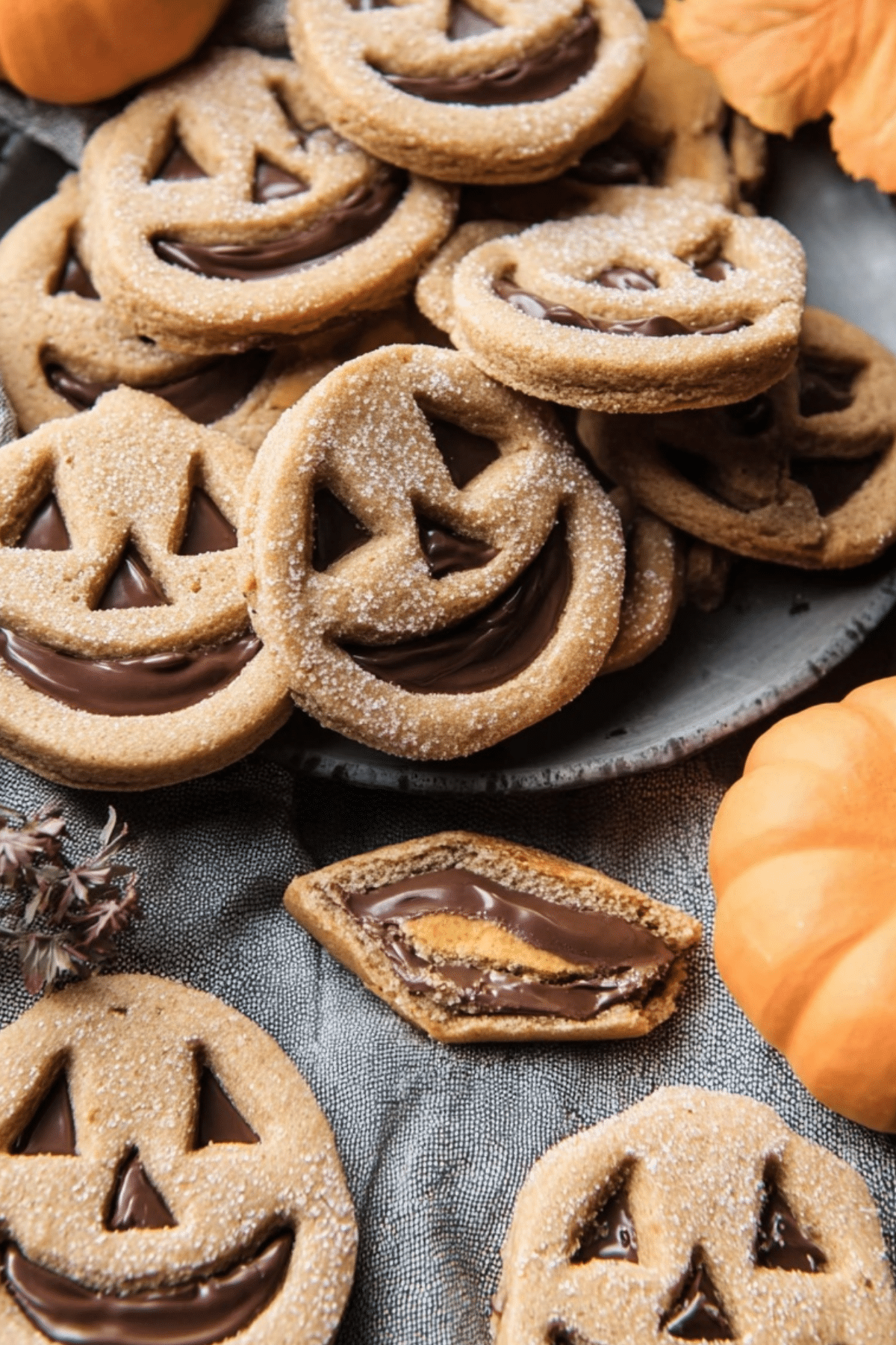 Milk Chocolate Stuffed Jack-O’-Lantern Cookies on a cooling rack