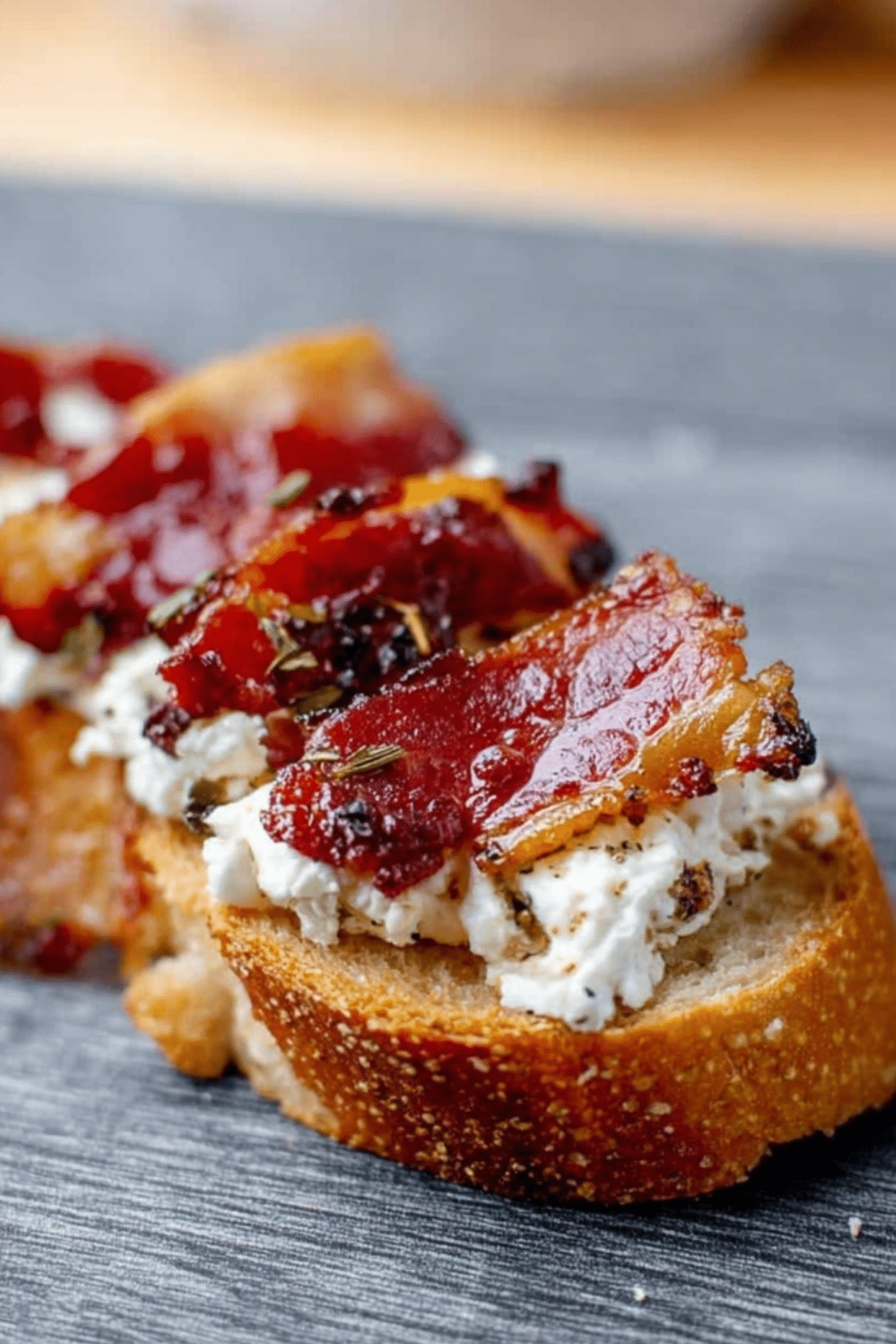 Million Dollar Bacon Goat Cheese Appetizer Log with crostini and hot honey drizzle