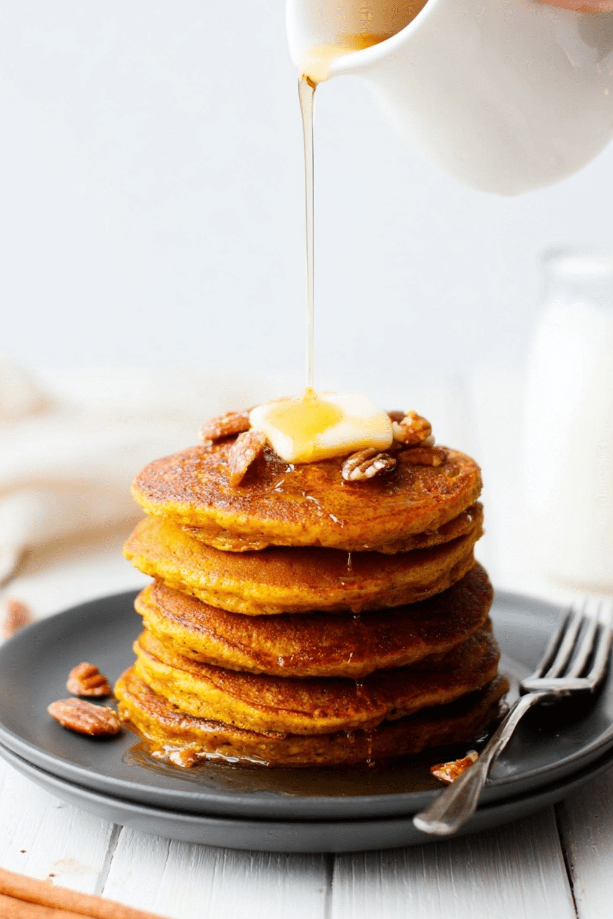 Oatmeal Pumpkin Pancakes with syrup and toppings