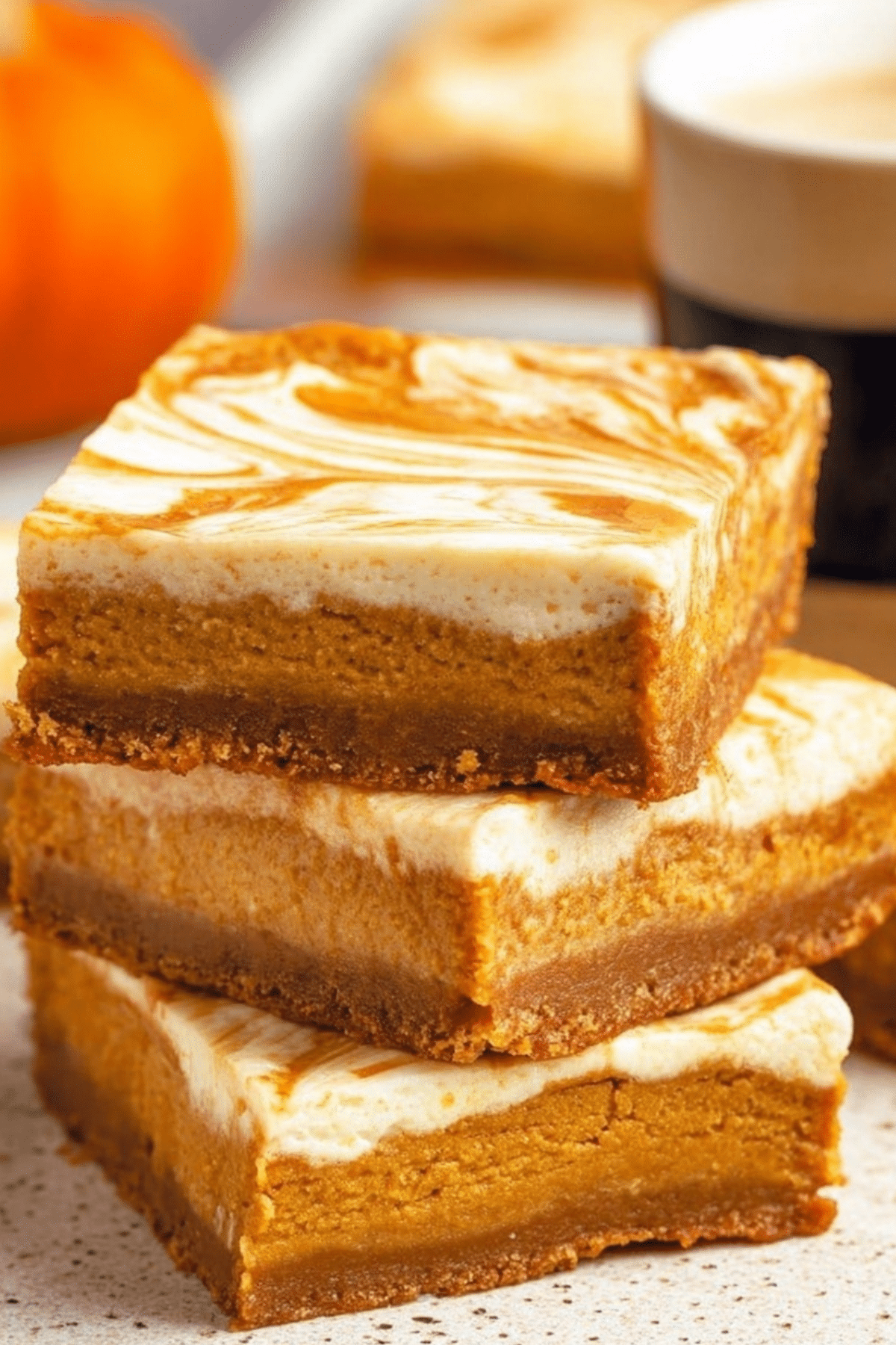 Pumpkin Cheesecake Bars with creamy swirl and graham cracker crust