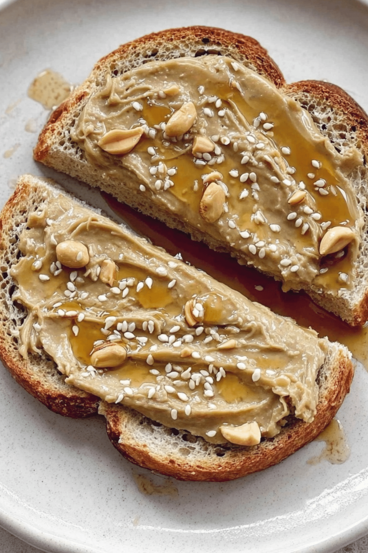 Tahini Honey Toast with sesame seeds and honey drizzled on top