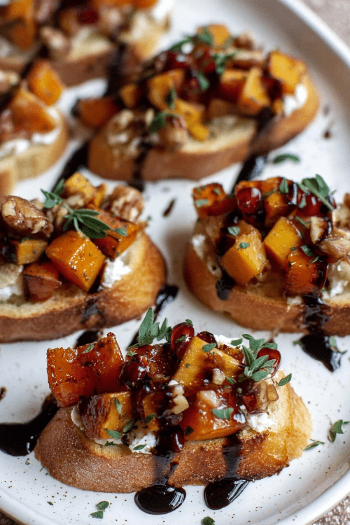 Fall Bruschetta recipe with roasted butternut squash, apples, goat cheese, and balsamic glaze