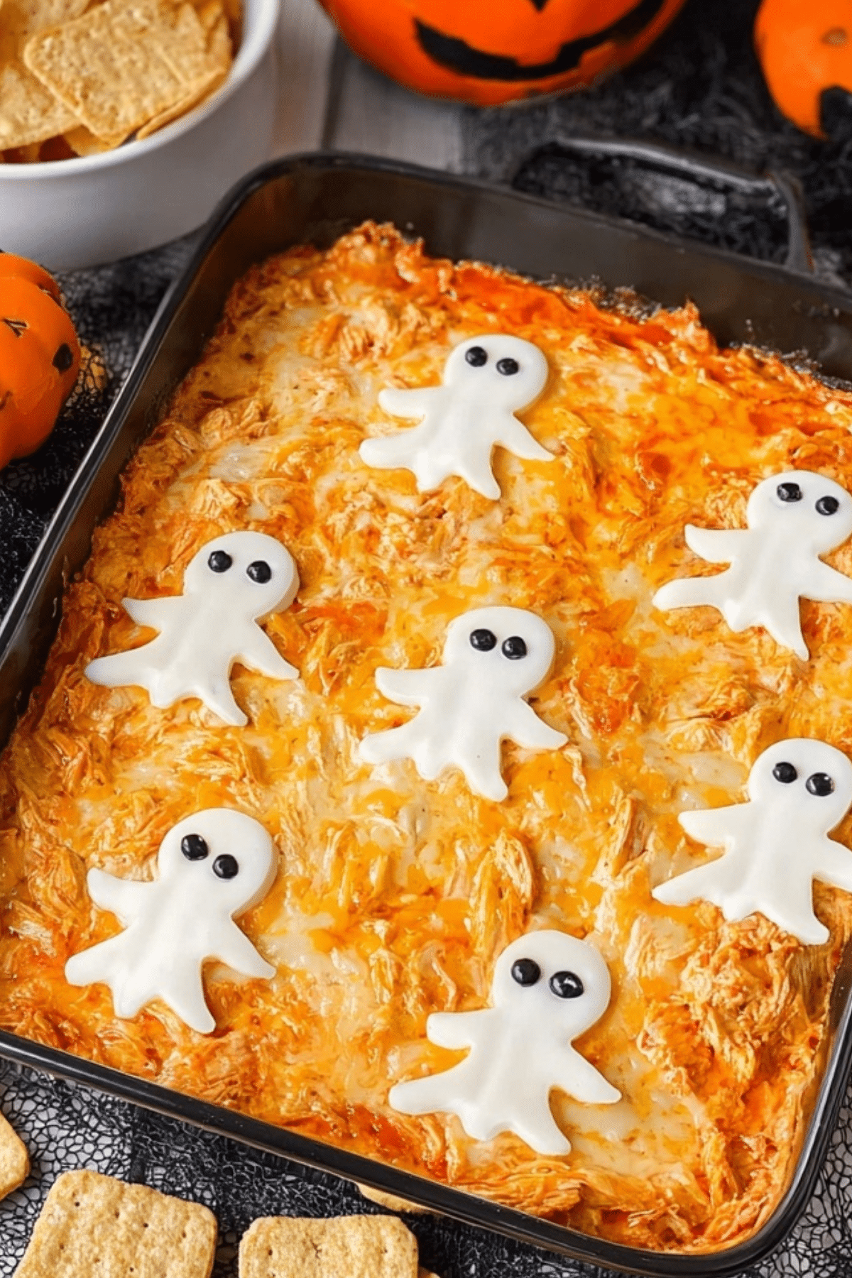 Halloween Buffalo Chicken Dip with cheese ghosts on top