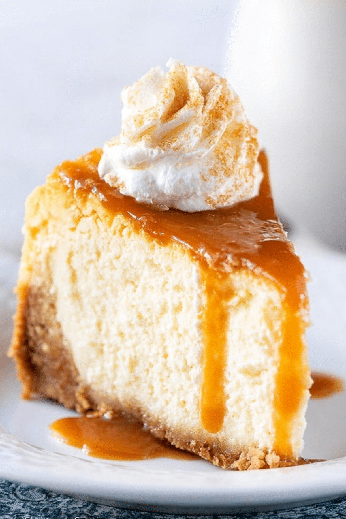 Salted Caramel Cheesecake with caramel drizzle and whipped cream