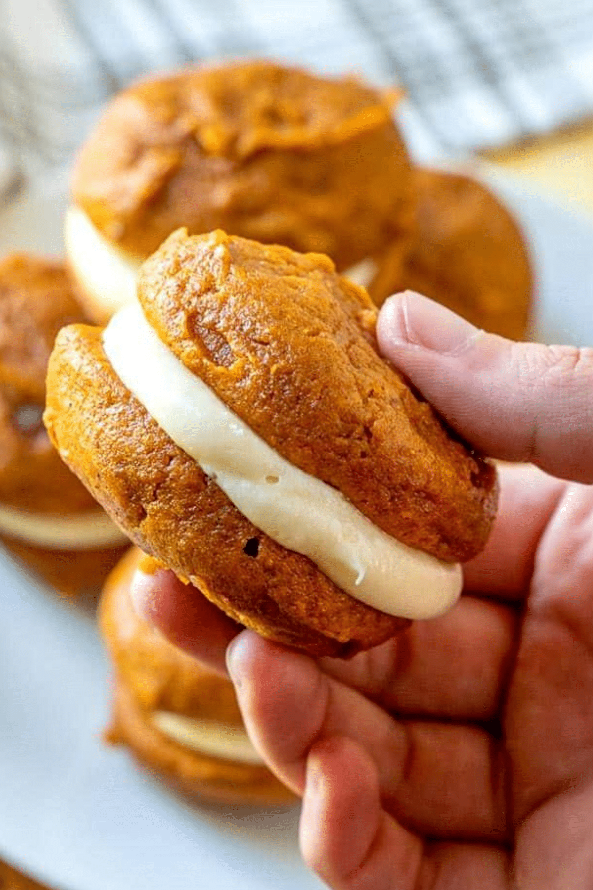 Pumpkin Whoopie Pies with maple cream cheese filling on a tray