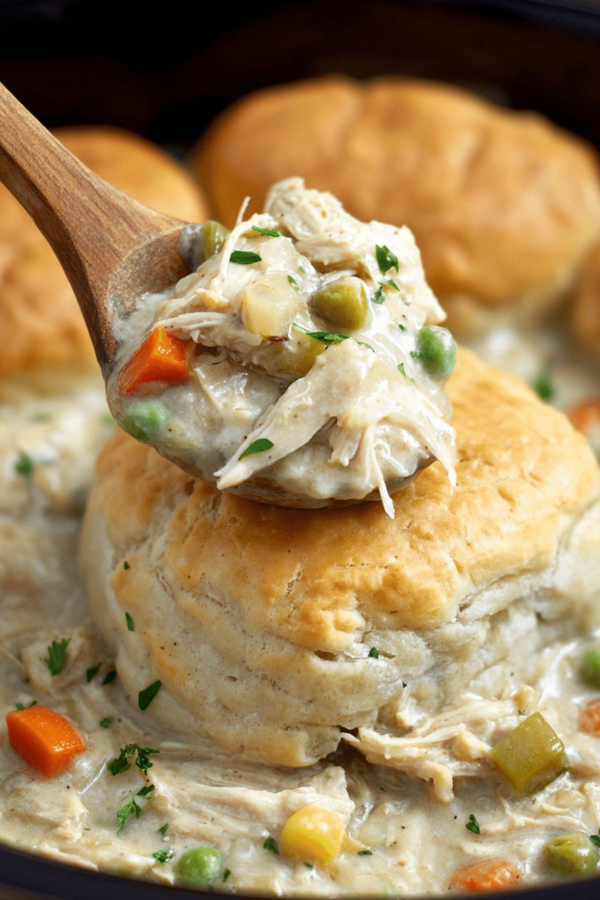 Slow Cooker Chicken Pot Pie with flaky biscuits and creamy filling