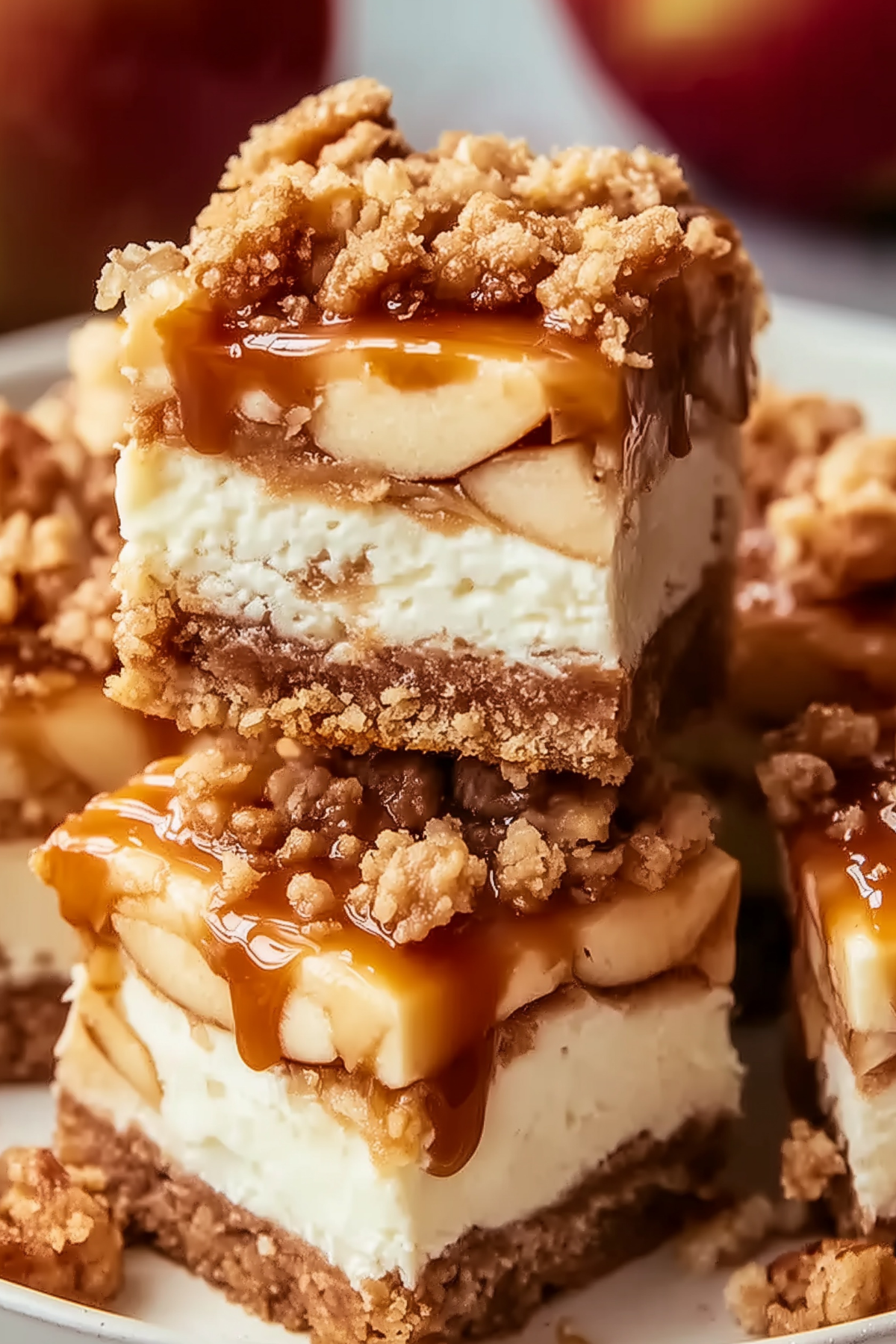 : Caramel Apple Cheesecake Bars served with warm caramel drizzle