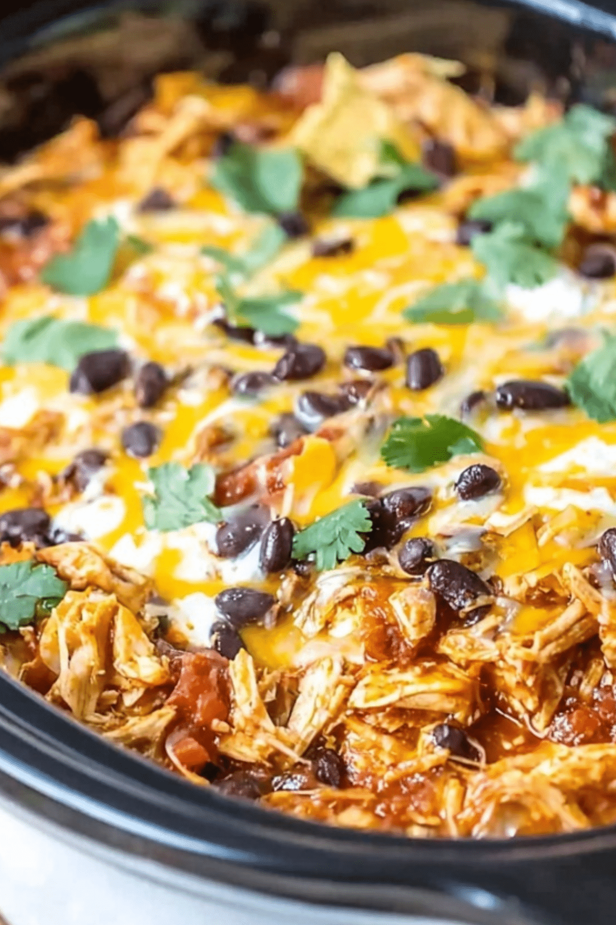 Crockpot Chicken Enchilada Casserole with cheesy and flavorful layers