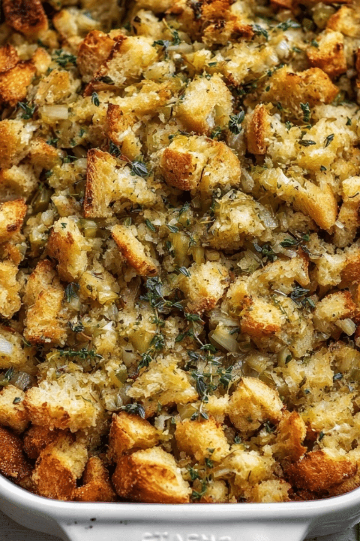 Buttery Herb Stuffing in baking dish with golden crispy edges