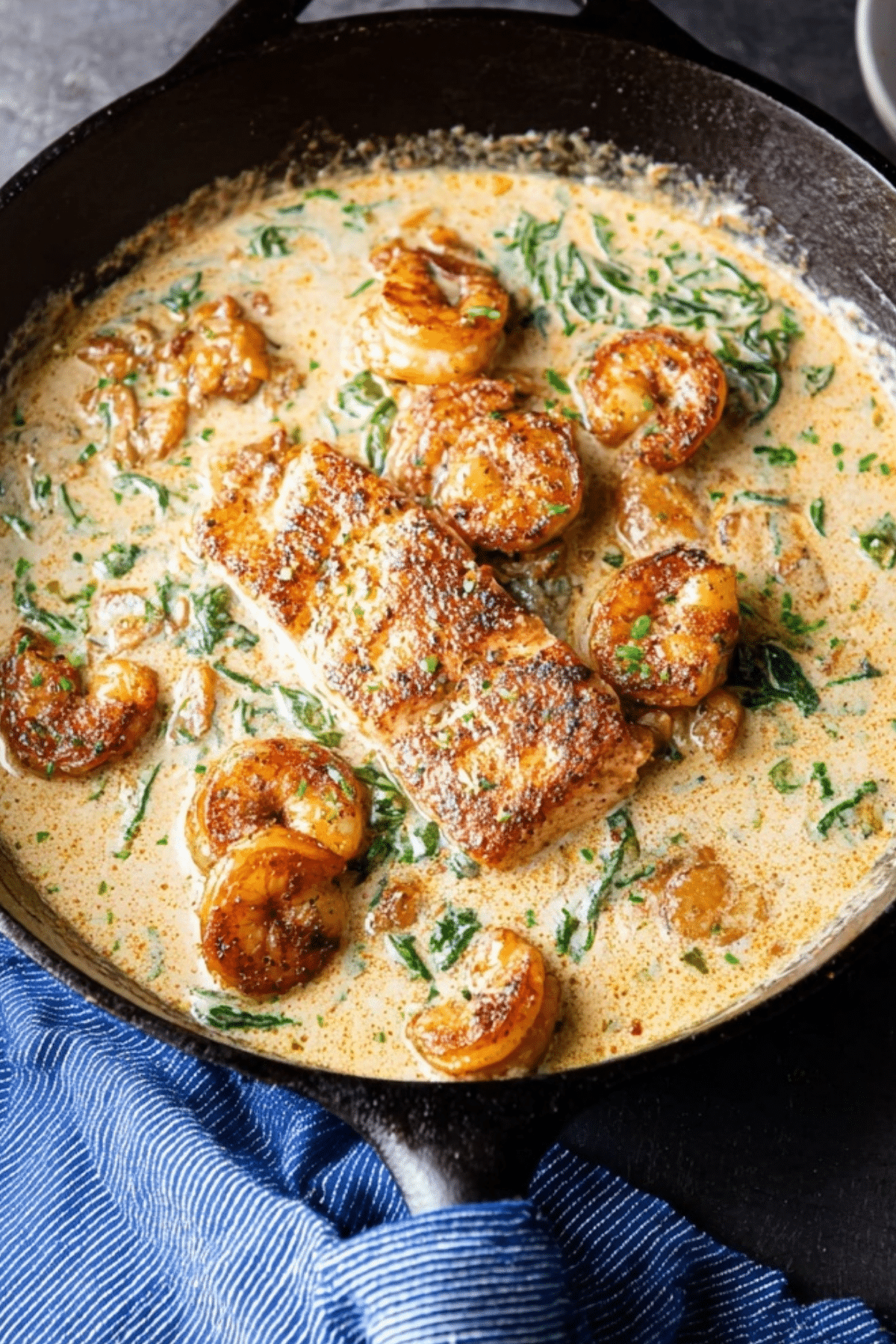 Cajun Salmon and Shrimp in Creamy Spinach Cheese Sauce