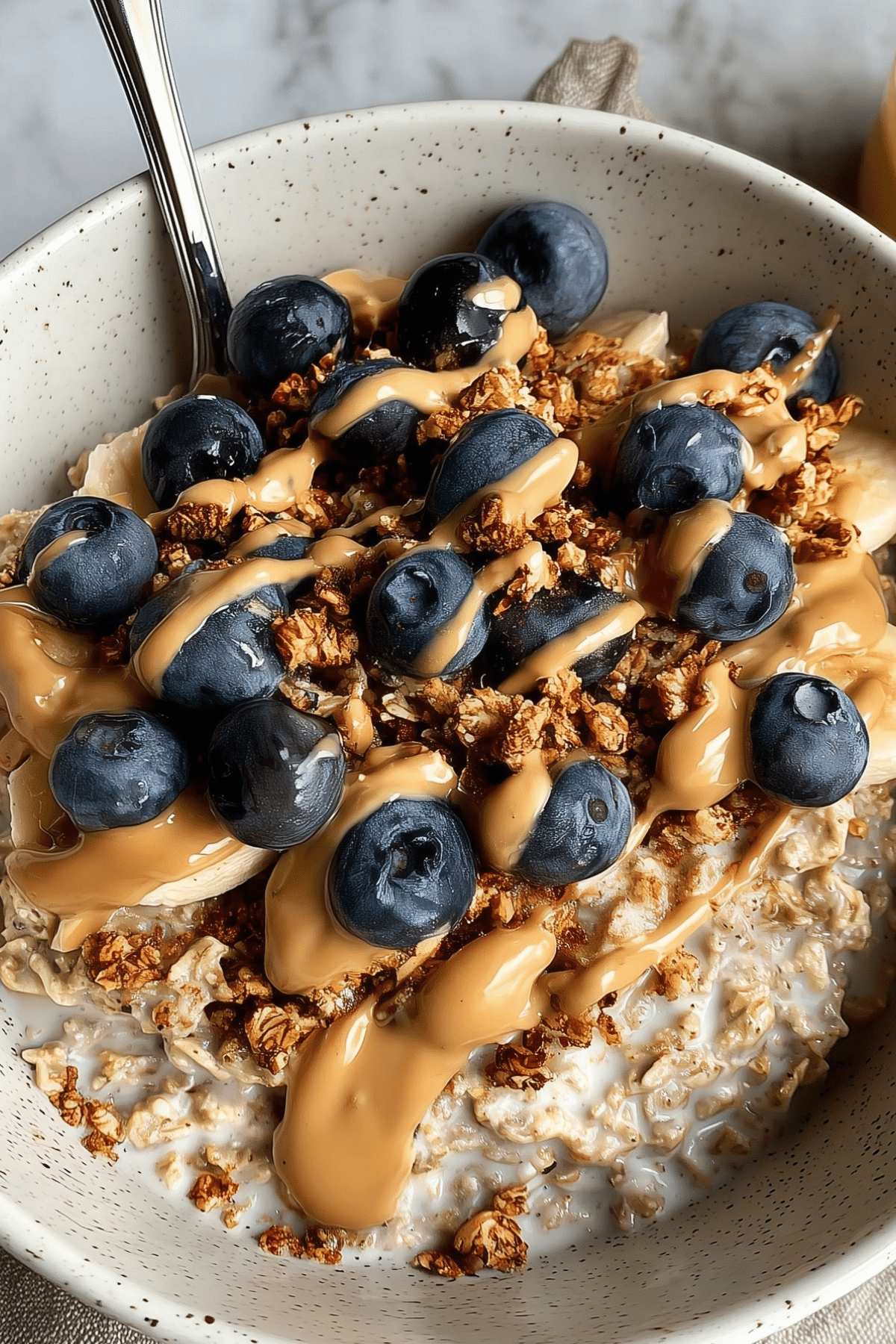 creamy jar of classic overnight oats with fresh fruit topping