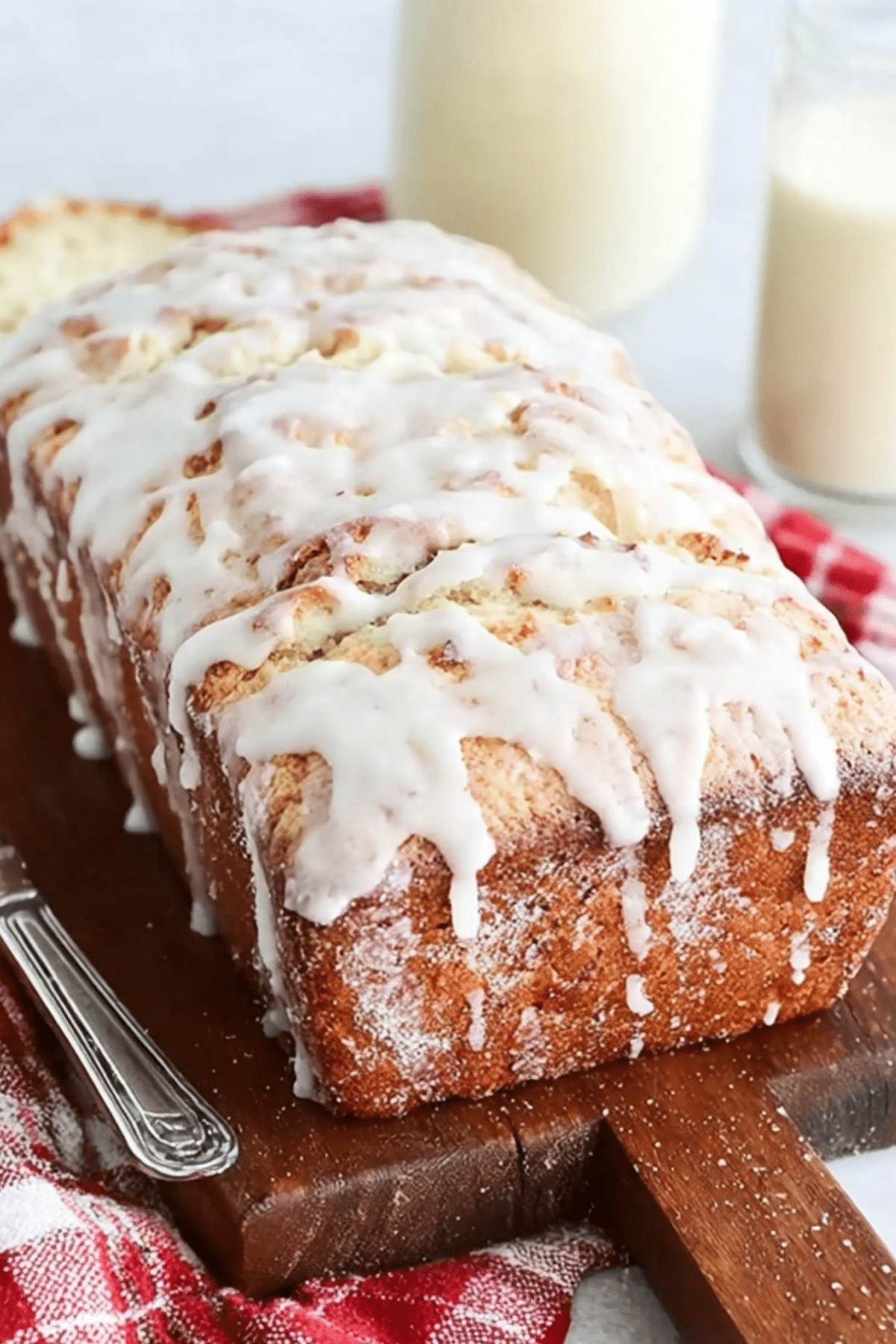 Eggnog Bread with sweet glaze on a holiday plate