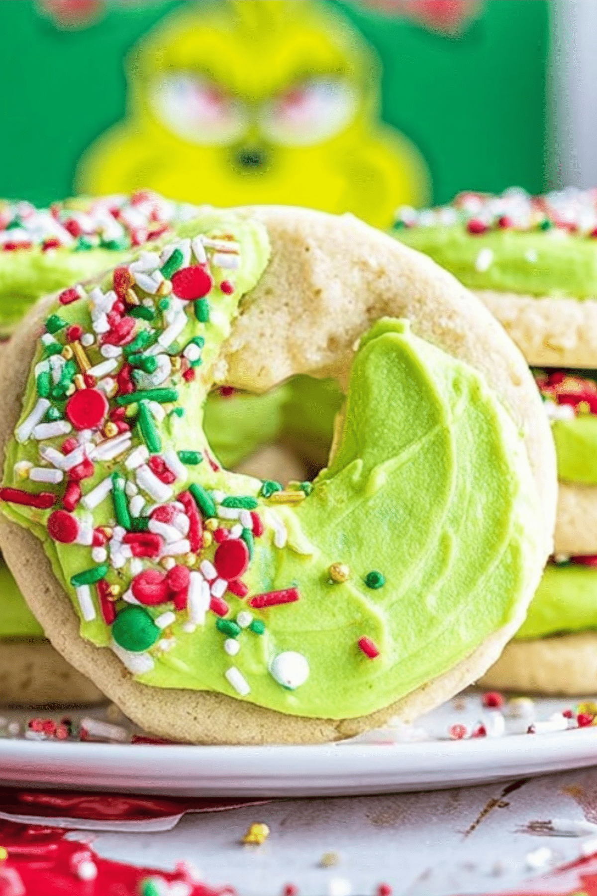 Grinch Crumbl Christmas Sugar Cookies with green frosting and red heart