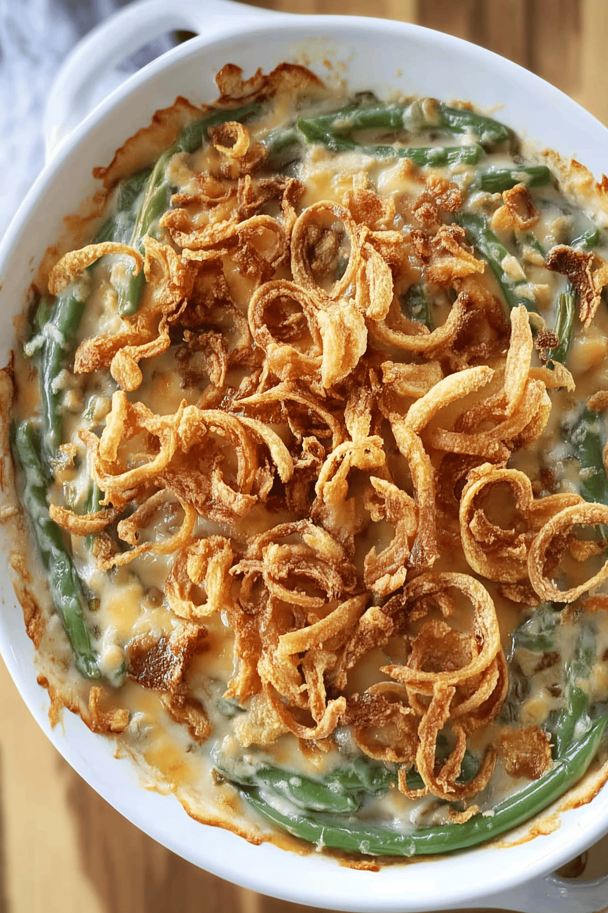 Homemade green bean casserole topped with crispy onions