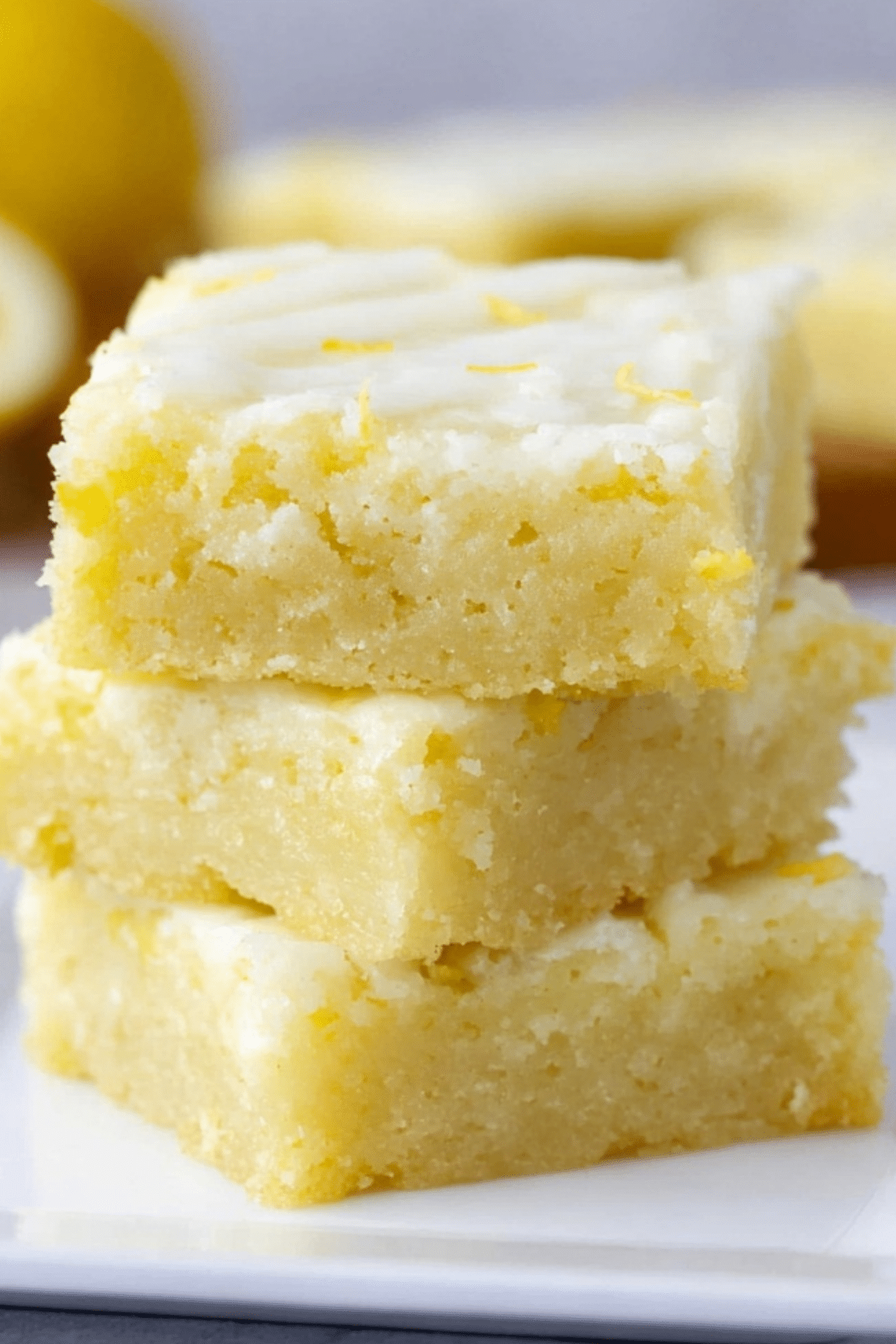 Lemon brownies topped with a tangy lemon glaze, perfect for any occasion.
