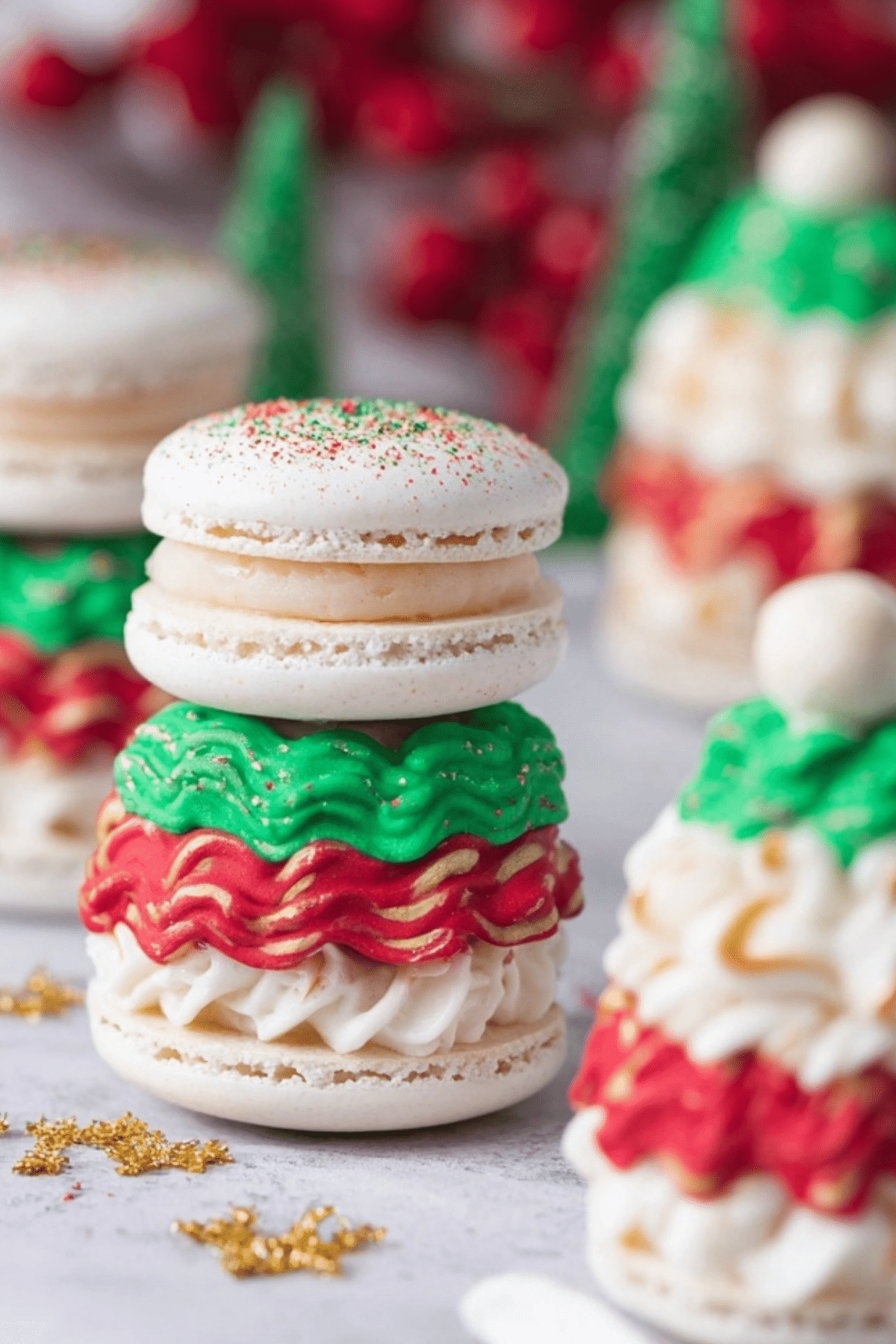 Christmas Tree Cake Macarons decorated with red and green sprinkles