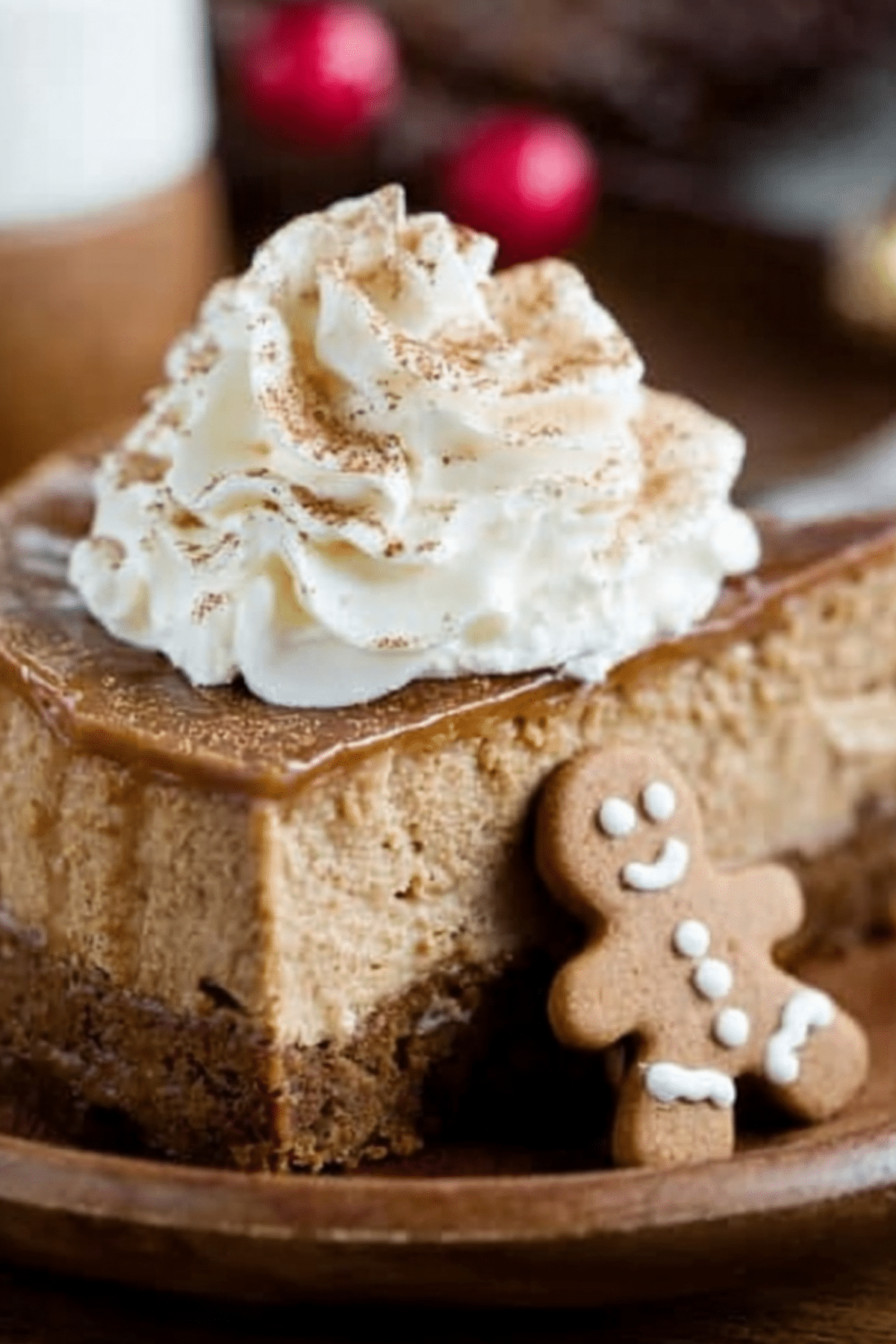 Gingerbread Cheesecake topped with whipped cream and spices