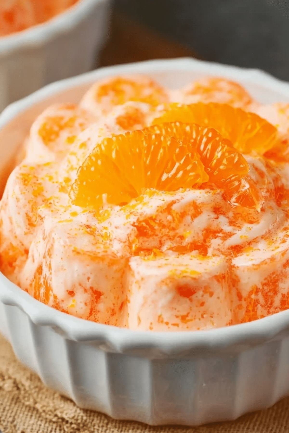 Creamy orange gelatin salad with mandarin oranges and pineapple