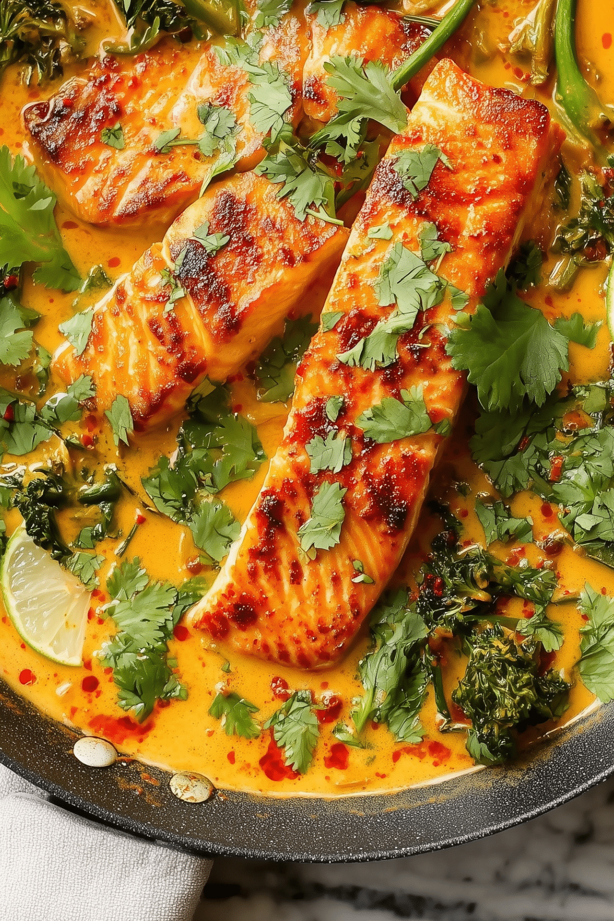 Salmon coconut curry in a creamy red curry sauce with vegetables