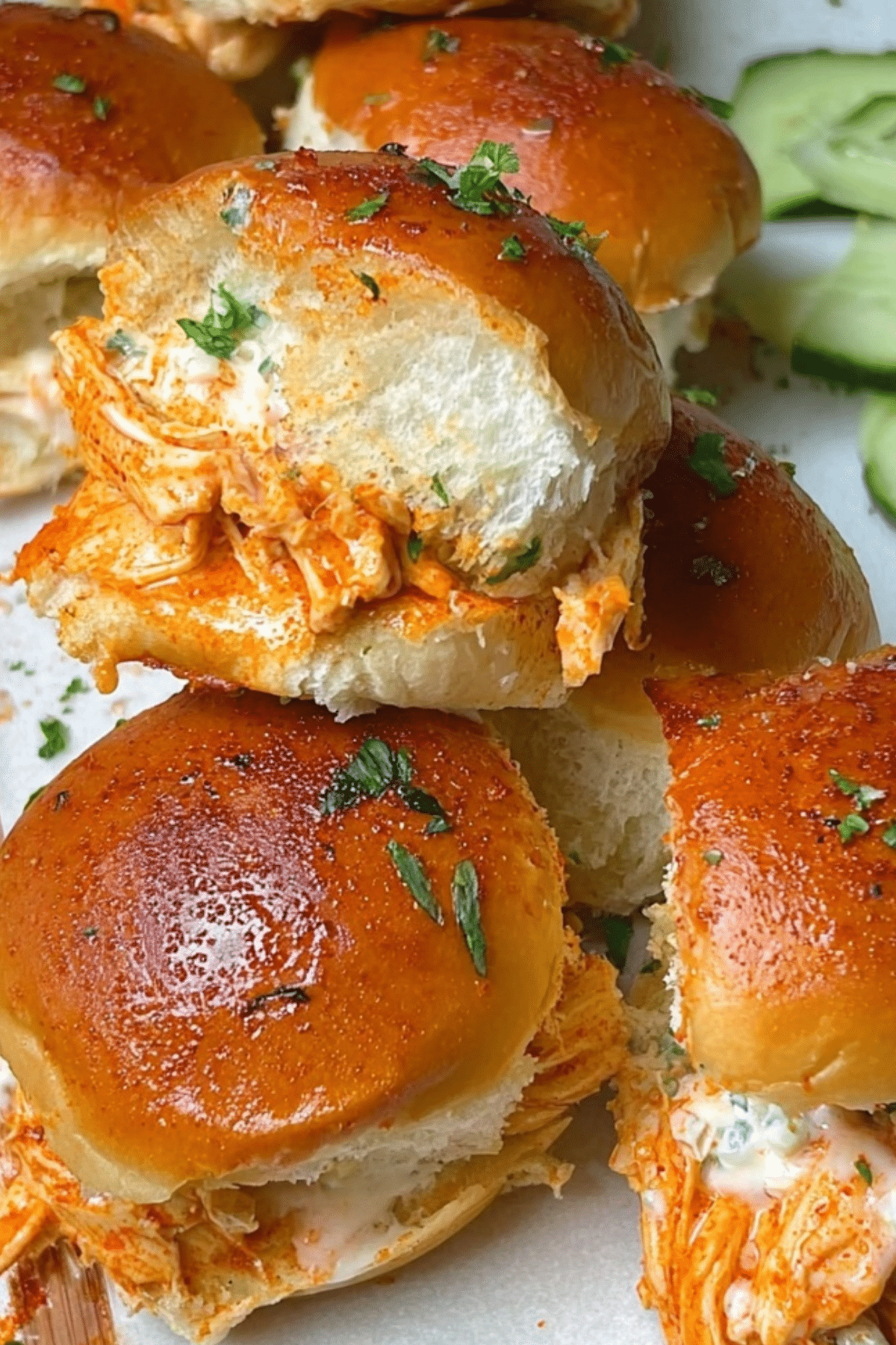 Buffalo Chicken Sliders served with melted cheese and garlic butter buns