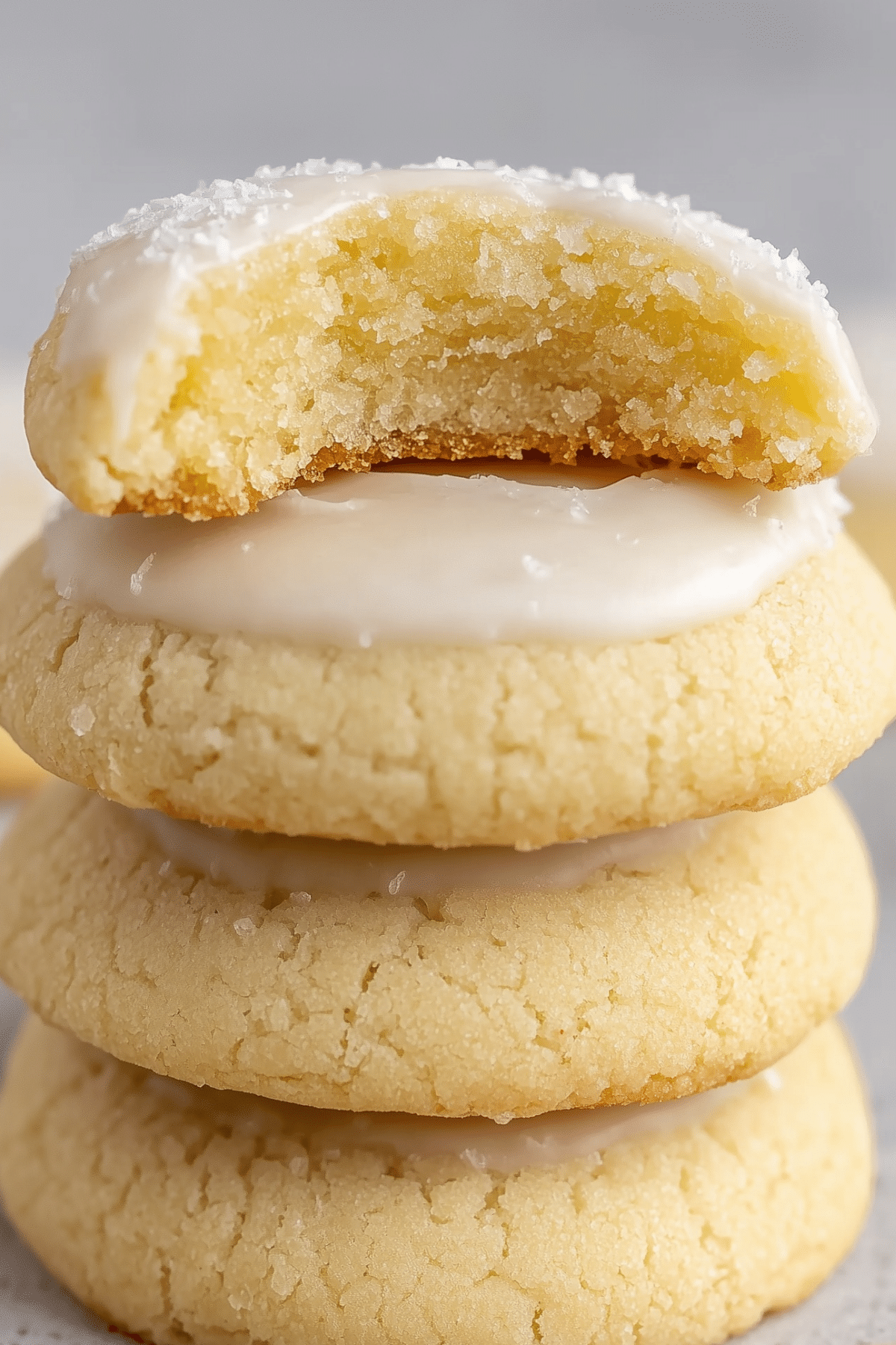 Almond Meltaway Cookies on a plate with almond glaze