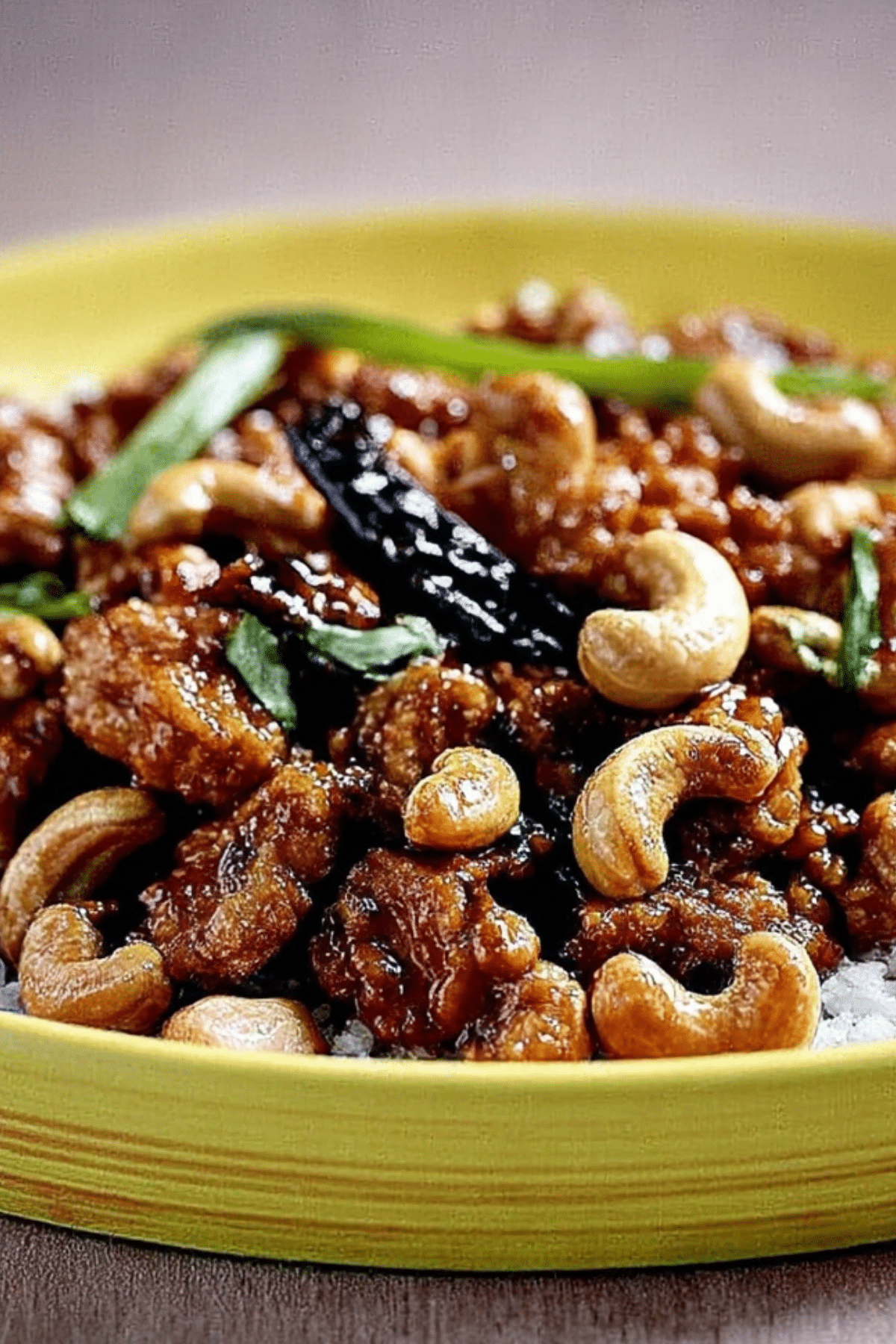 20 Minute Garlic Butter Cashew Chicken served over rice with cashews and green onions
