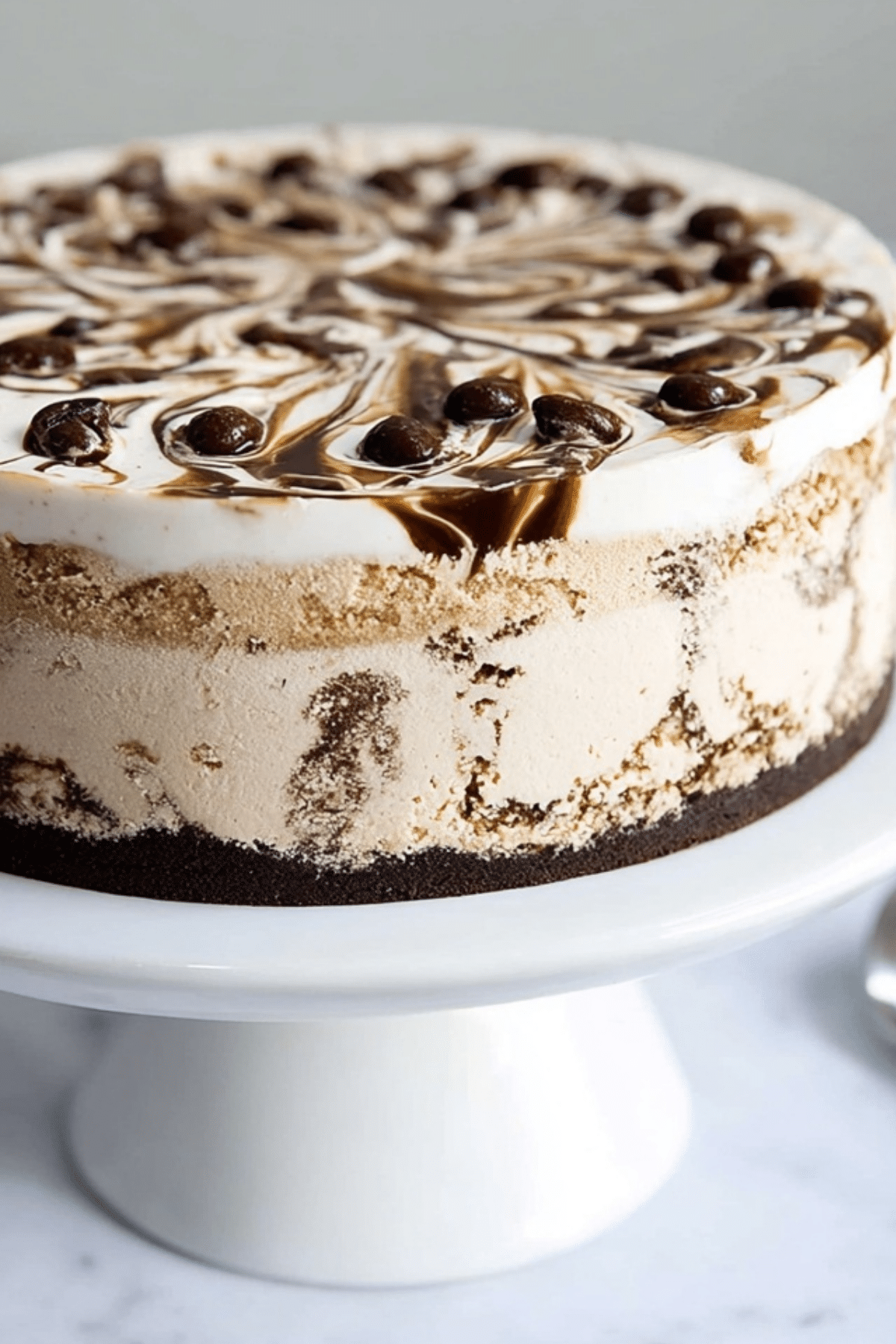 Coffee Ice Cream Cake layered with brownie, coffee ice cream, and fudge swirl