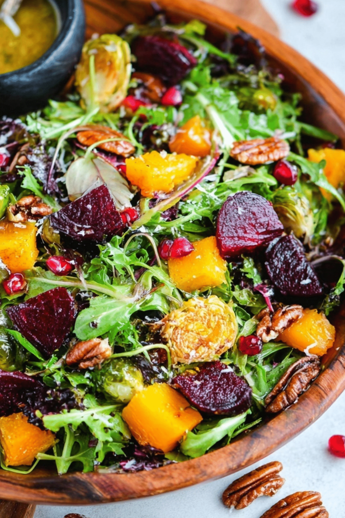 Warm winter salad with roasted vegetables and maple dijon dressing