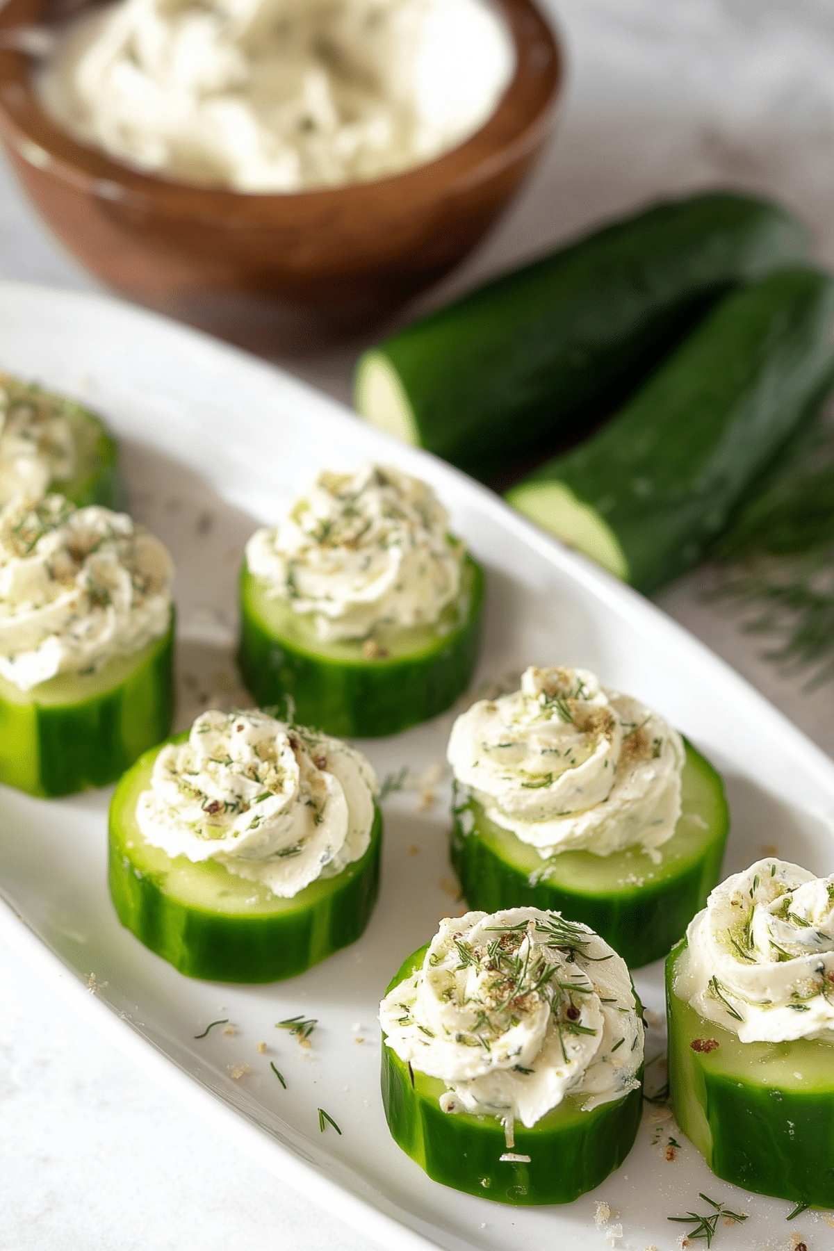 Cucumber Slices With Herb and Garlic Cheese topped with fresh chives