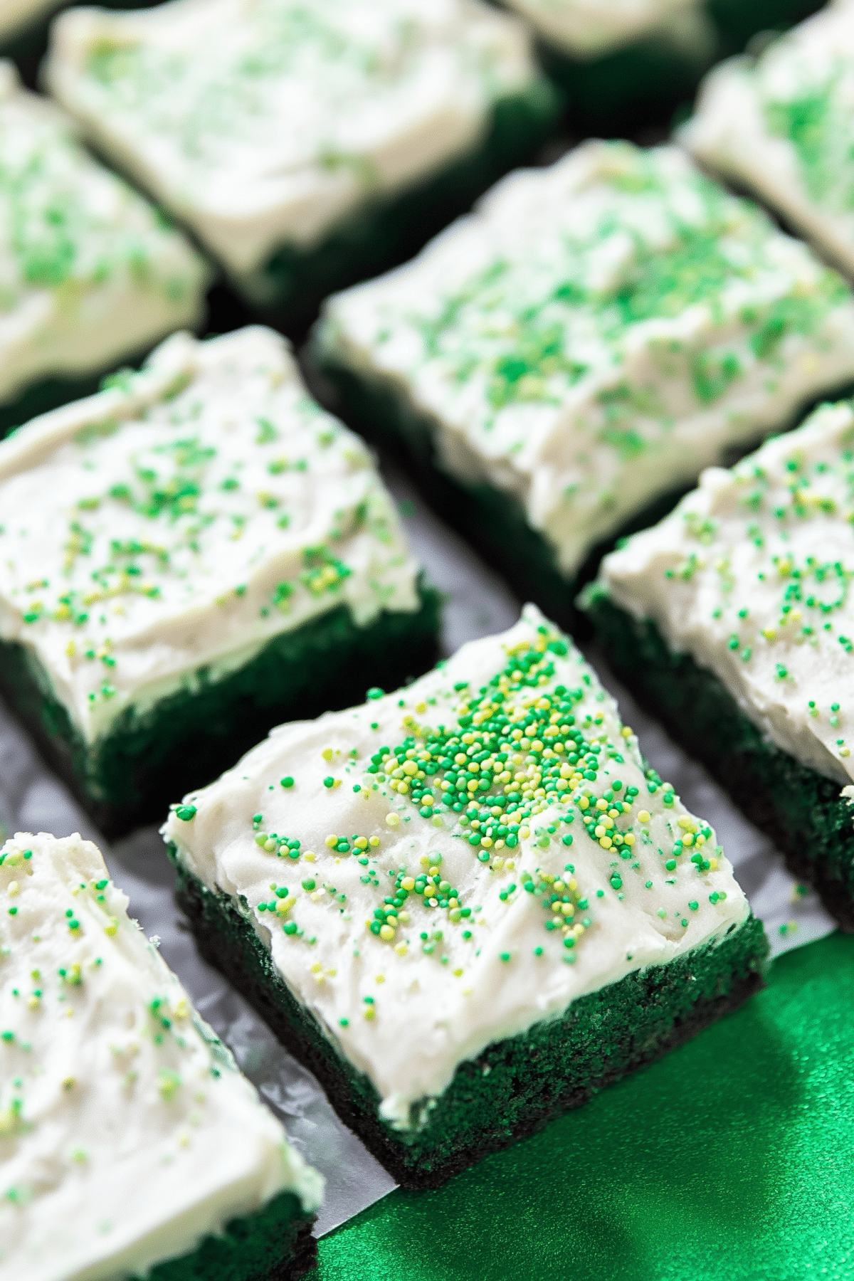 Green Velvet Brownies with Cream Cheese Frosting topped with smooth creamy frosting