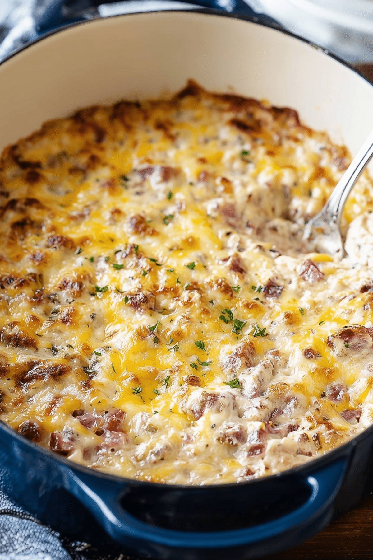 Hot Reuben Dip baked with corned beef, Swiss cheese, and sauerkraut