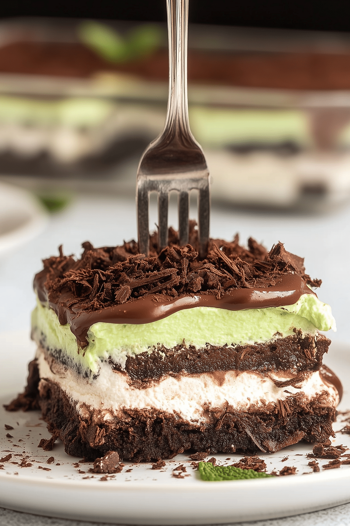 Mint Chocolate Lasagna layered dessert with Oreo crust and chocolate topping