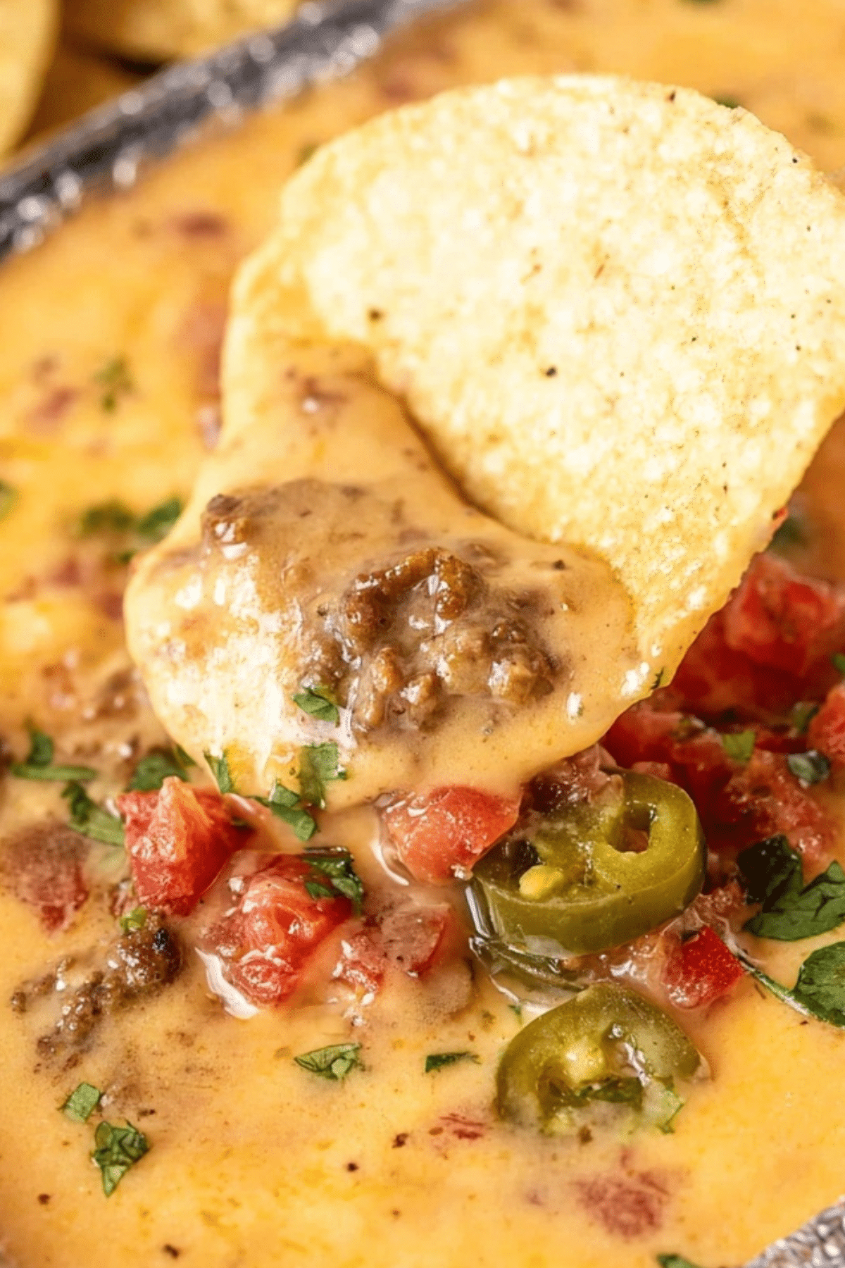 Smoked Queso Dip served in a bowl with tortilla chips and a smoky flavor
