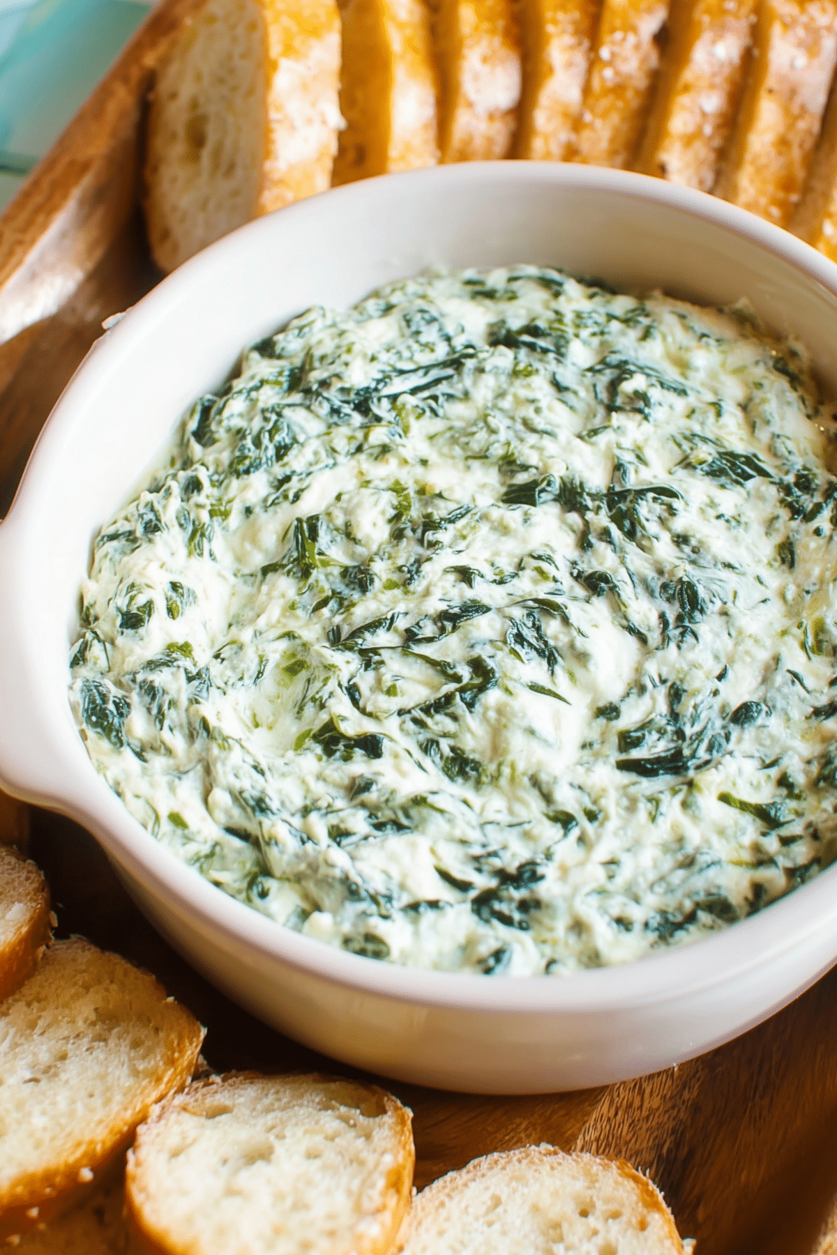 Creamy homemade Spinach Dip served warm with bread and vegetables